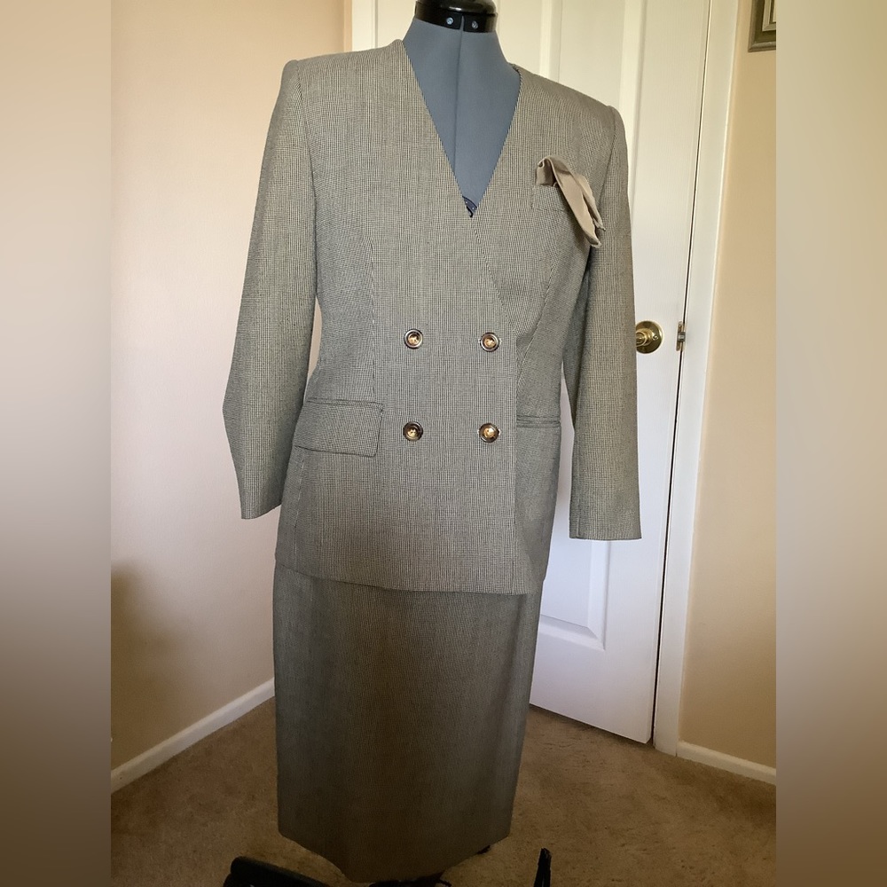 Emily Tan and black 2 piece jacket and skirt.